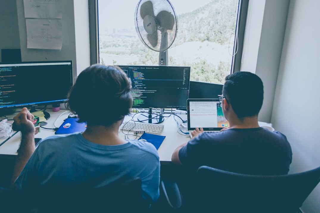 software developers coding together