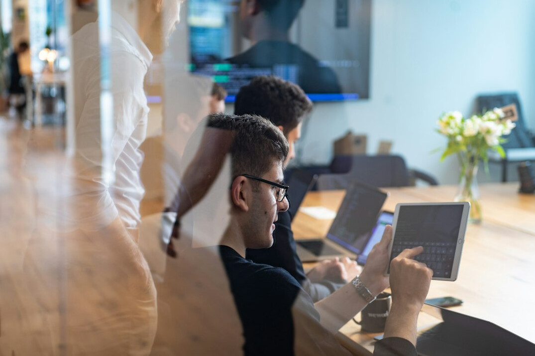 corporate team collaborating on code